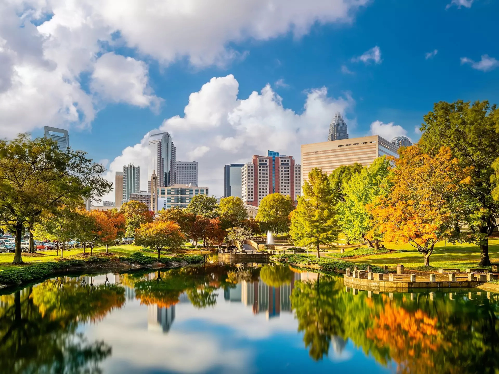 Charlotte, NC skyline reflected over Marshall Park in fall
